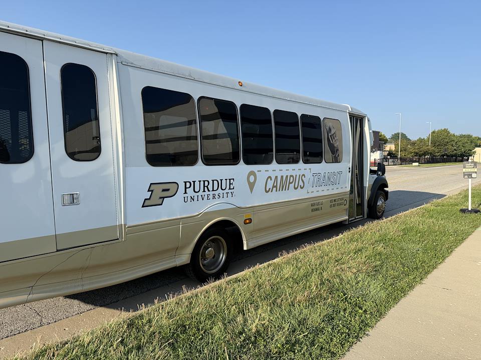 Indianapolis Campus Transit shuttle bus parked along curb