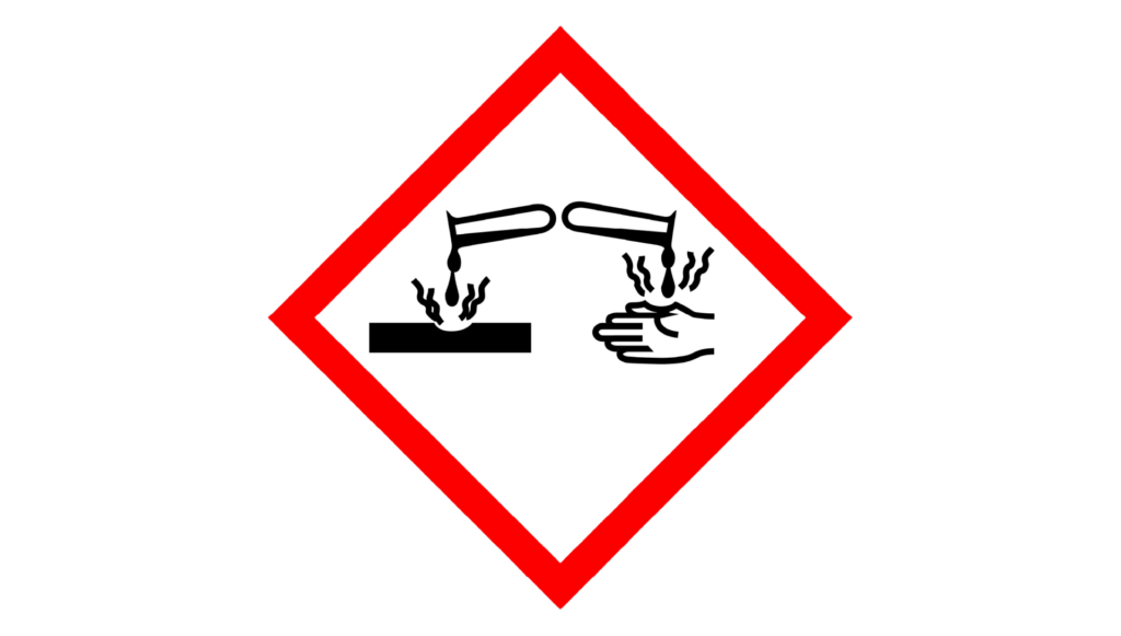 Corrosive symbol: Red diamond showing liquid corroding a hand and metal.