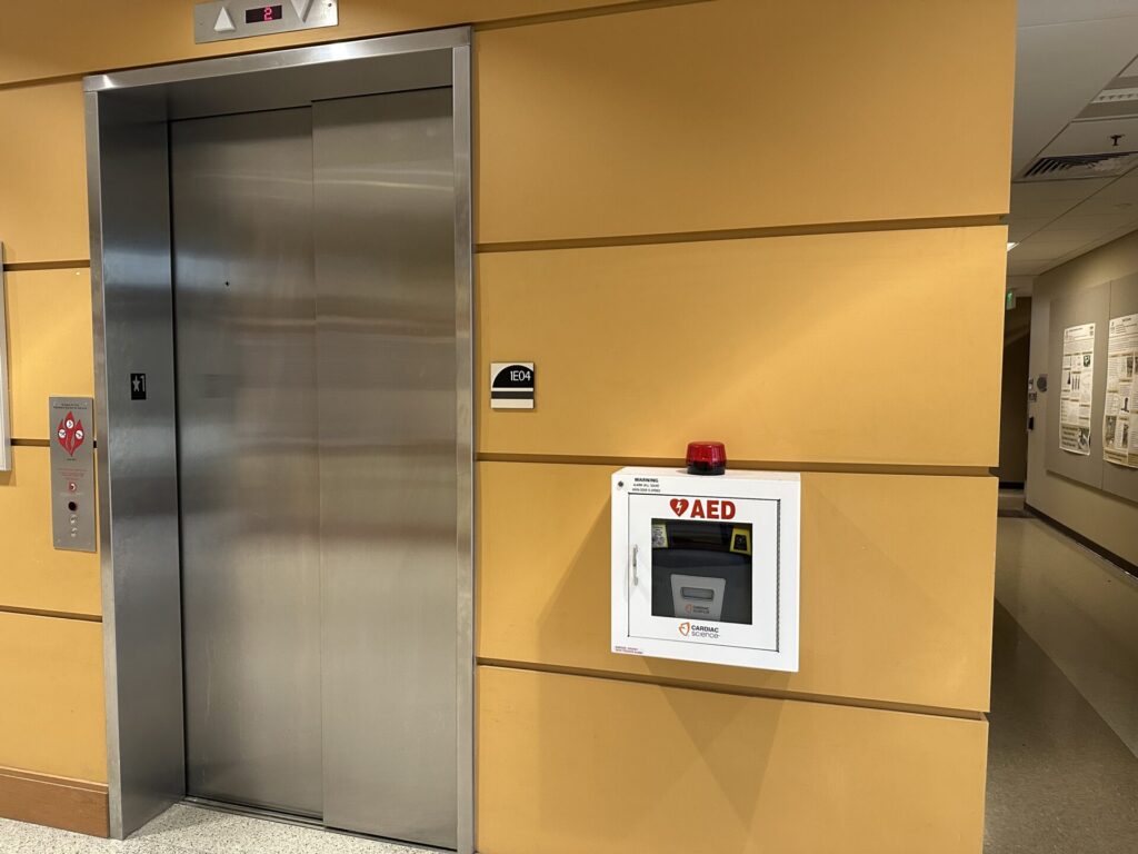 Picture of AED installed in an elevator lobby space