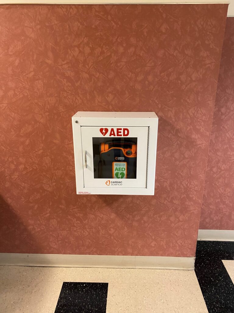 Wall with white AED box