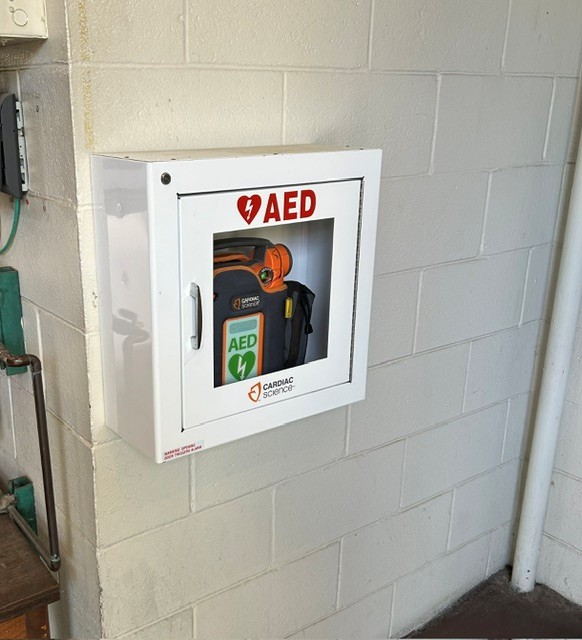 Image of installed AED near the entrance to the Fire Department Day Room.
