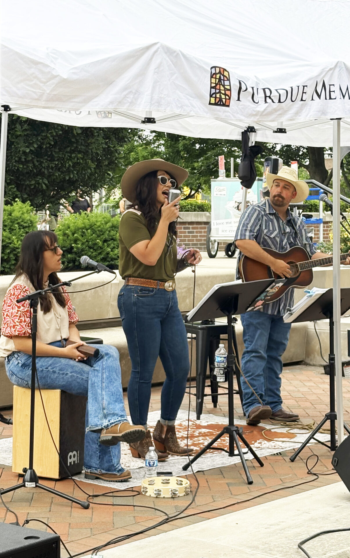 Female singing on East Terrace stage during Summer Concert Series.