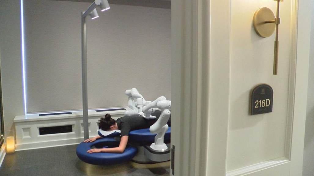 Women laying on Aescape AI-powered massage table in The Spa Union Club Hotel