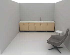 Wellness room rendering with sink and base cabinets on the back wall and a lounge chair for single-occupancy use.