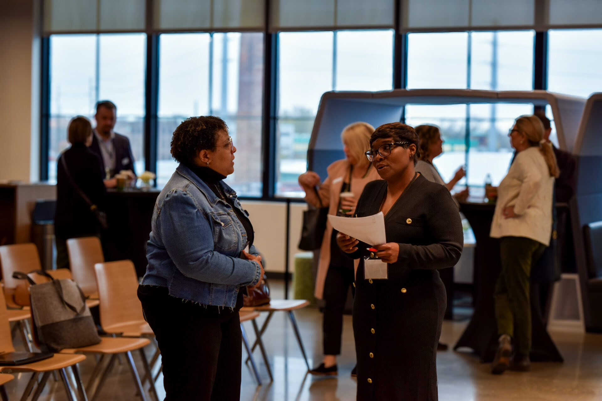 Two women conversing during the R2P event.
