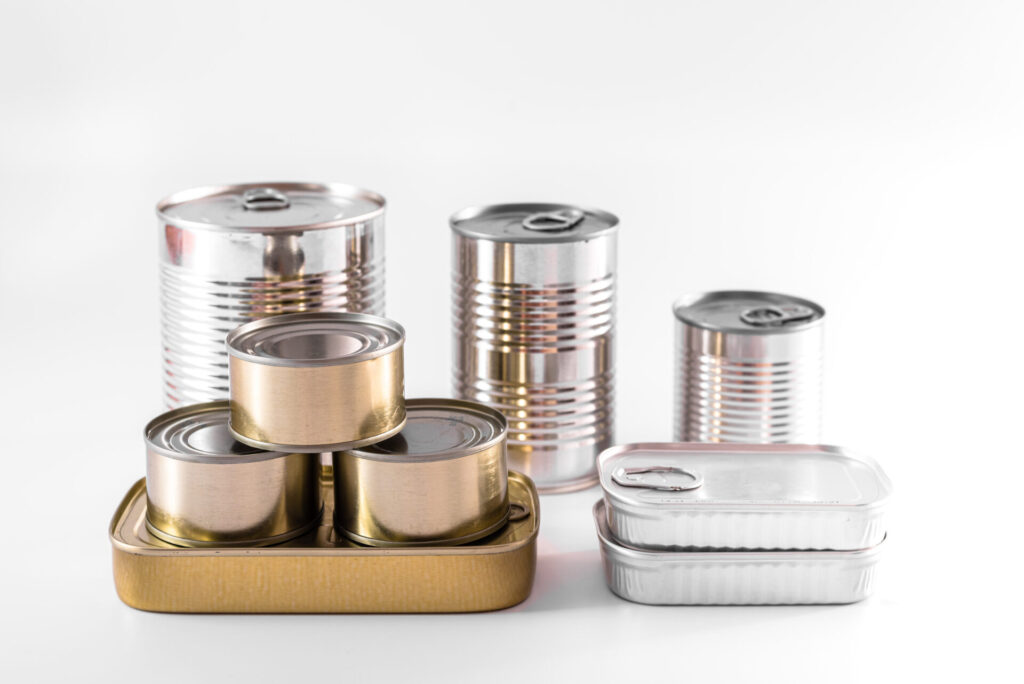 Several generic aluminum food cans, isolated on white studio background, to store food for years.