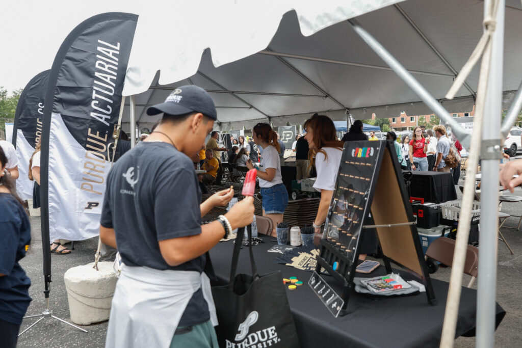 Students gather at information booths