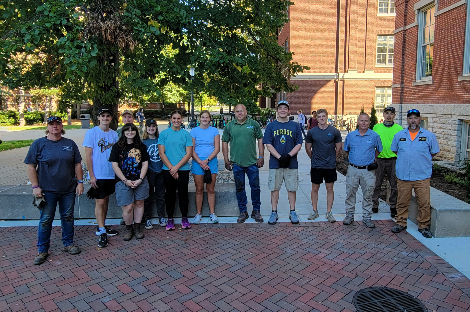HORT 317 students and Purdue Grounds staff work together on new landscaping around University Hall.