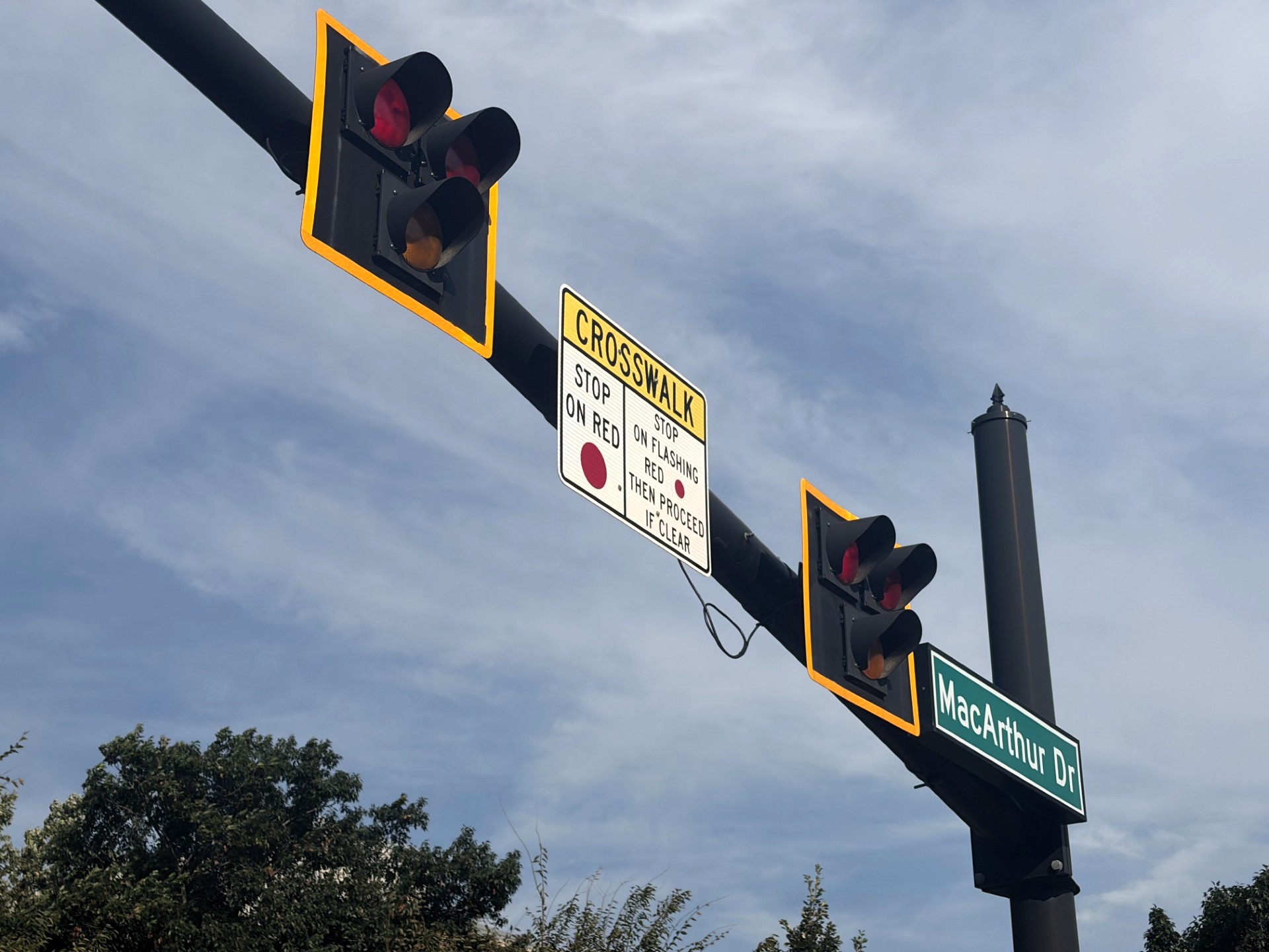 The current crosswalk signals at the intersection of Mitch Daniels Boulevard and MacArthur Drive will be replaced with new signage and flashing beacons over fall break. Photo by Administrative Operations Communications.