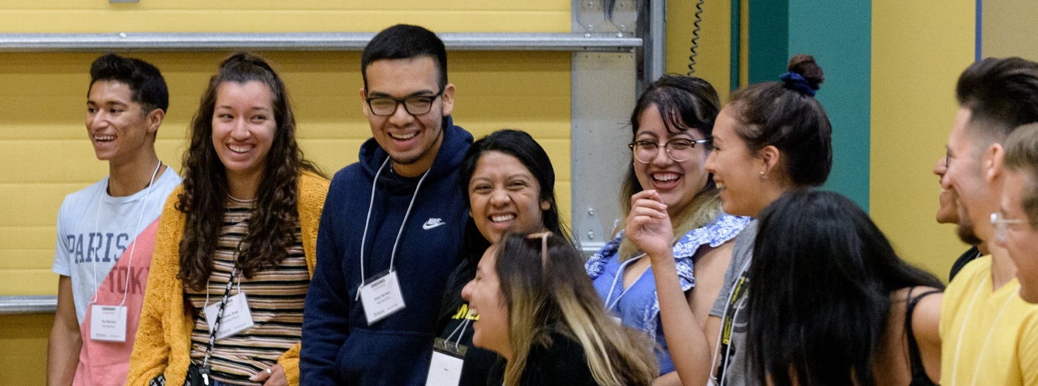 Students participating in Latino Cultural Center events, laughing and smiling together