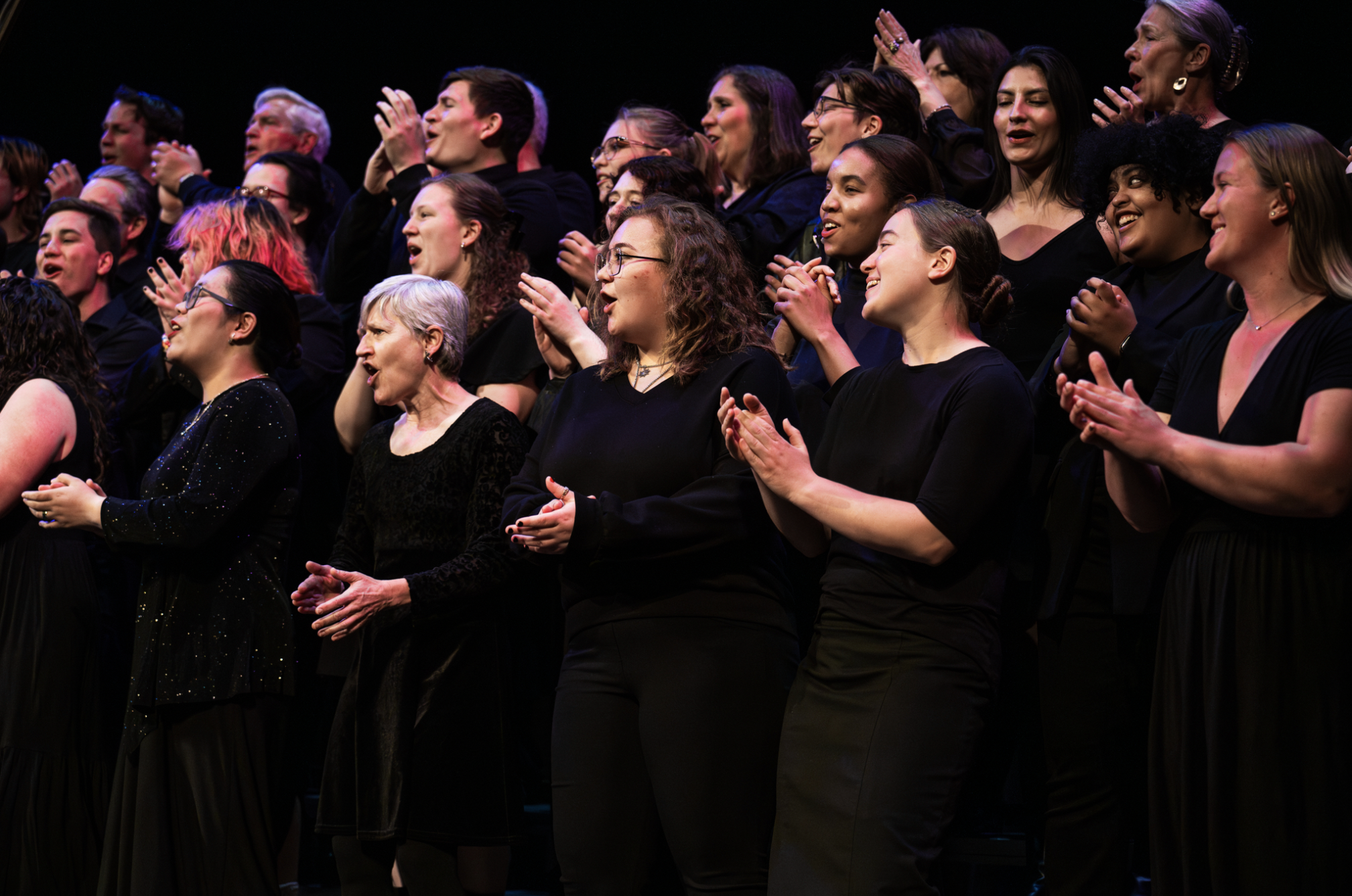 All Campus and Community Chorale standing on stage