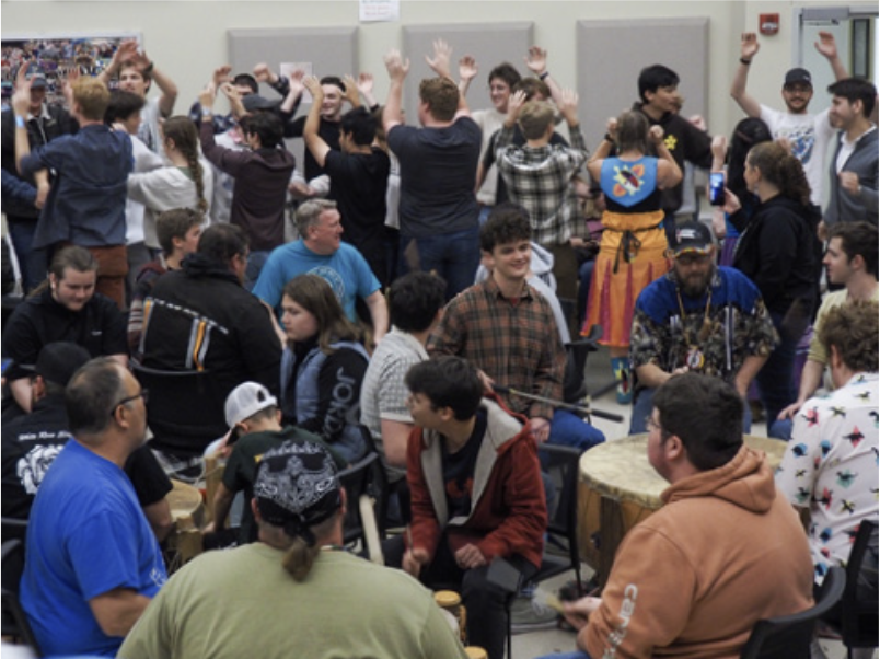 Photo of the Purdue Varsity Glee Club and the Miami Tribe Interacting (Credit: Christopher Wolford)