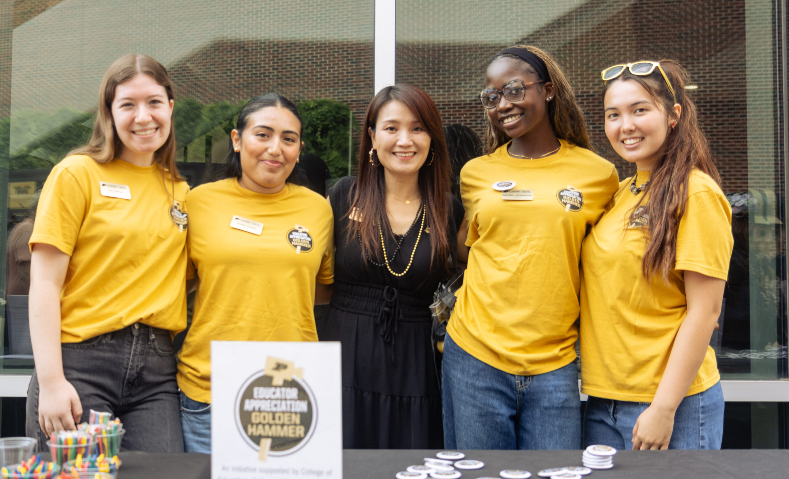 First Lady Kei Hui with a group of student volunteers at the Golden Hammer Educator Appreciation game