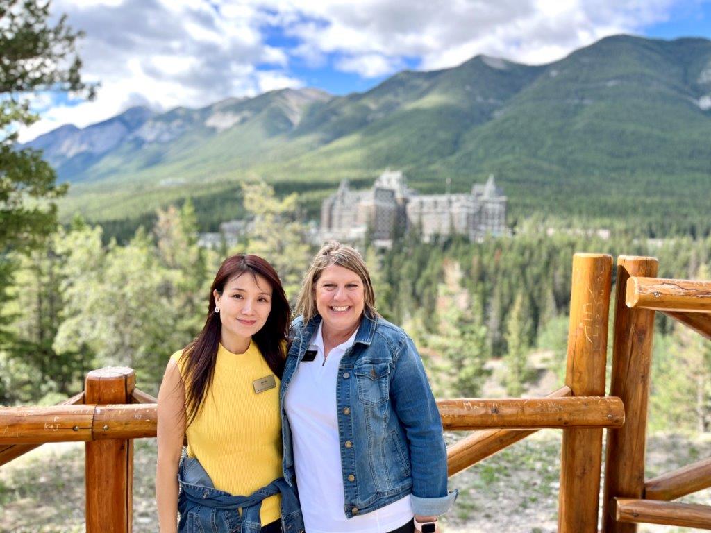 Executive Director of the President's Council, April Headdy taking a moment to capture a breathtaking shot of the iconic accommodations in Banff.