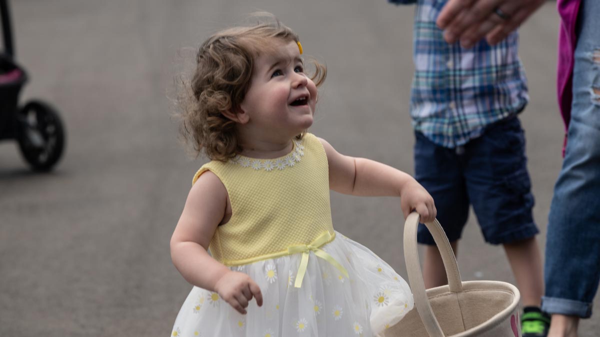 Child holding an Easter egg basket.