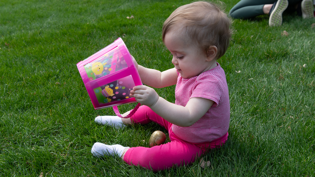 Child holding an Easter egg basket.