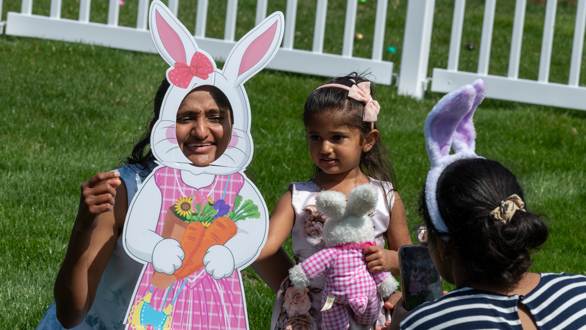 Family having fun at the Easter egg hunt.