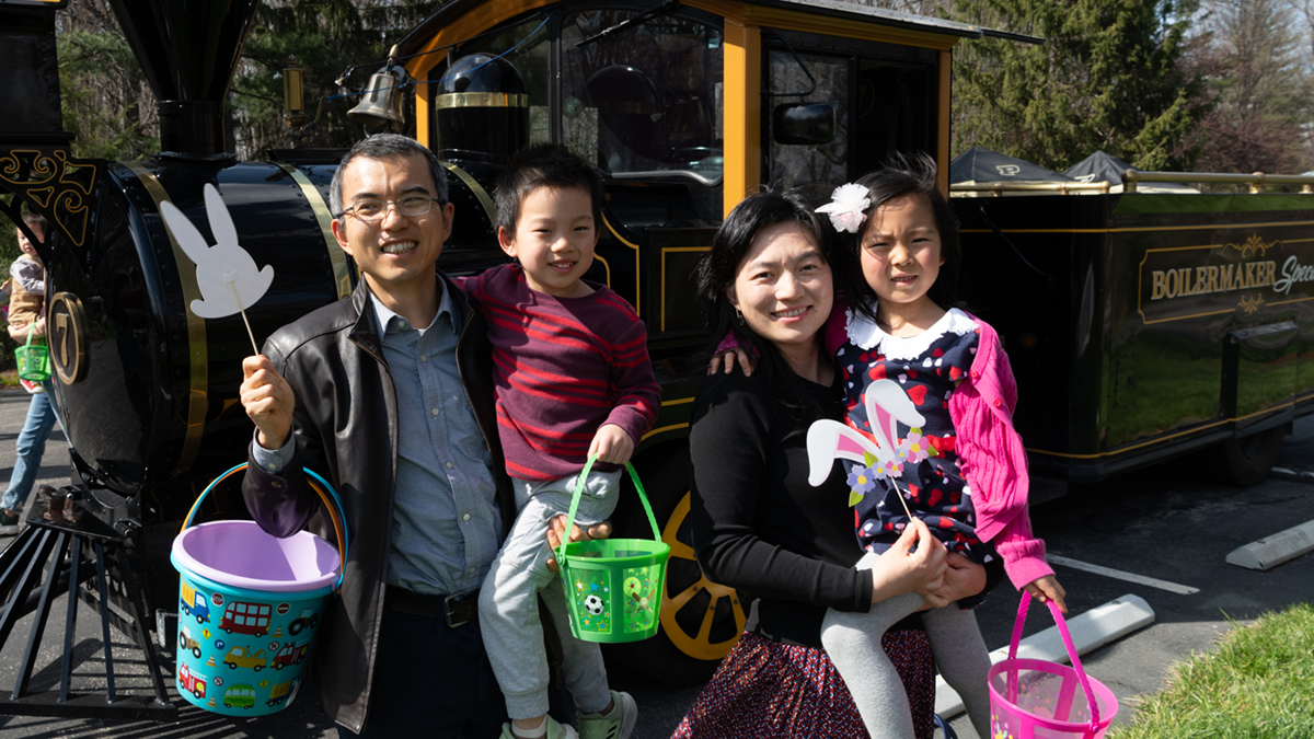 A family in front of the Boilermaker Special.