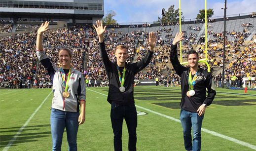 olympians Amanda Elmore, Steele Johnson, and David Boudia on the field of Ross-Ade stadium
