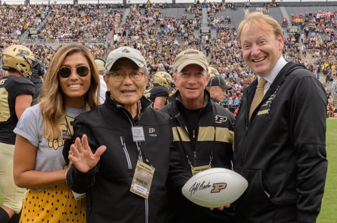 Ei-ichi Negishi poses with the Homecoming 2018 game ball