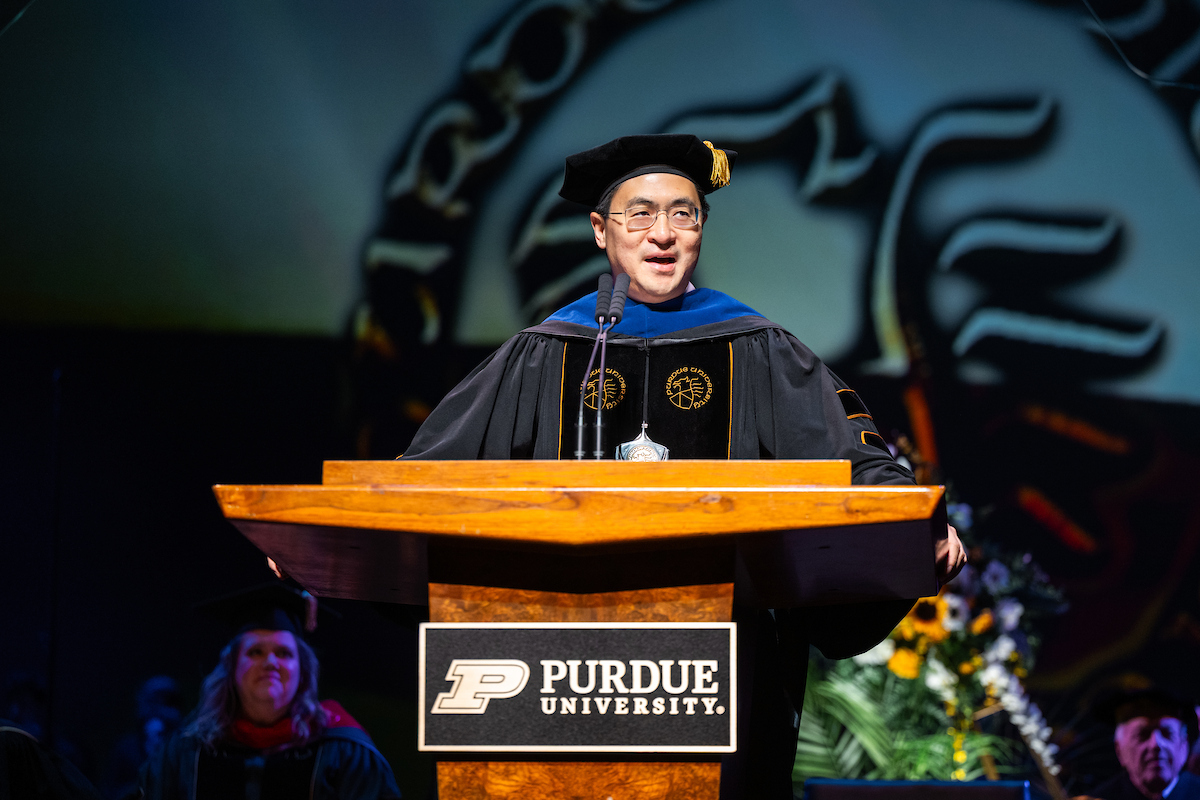 President speaking at podium at commencement