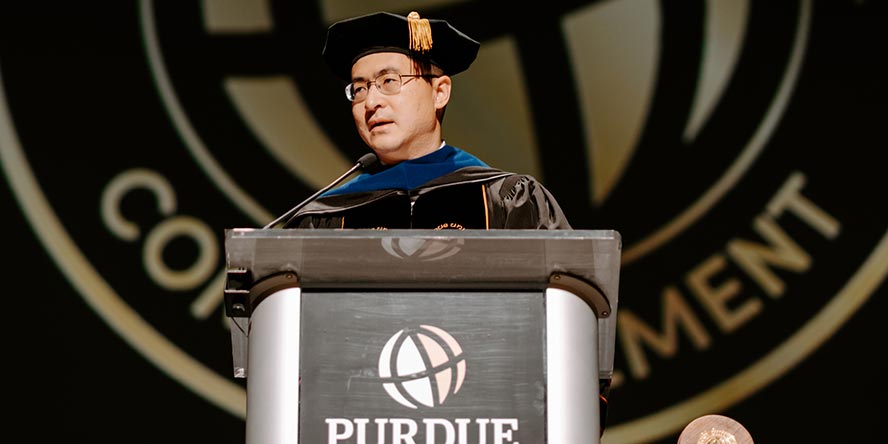 President Chiang addressing 1,400-plus Purdue Global graduates during Spring 2023 Commencement.