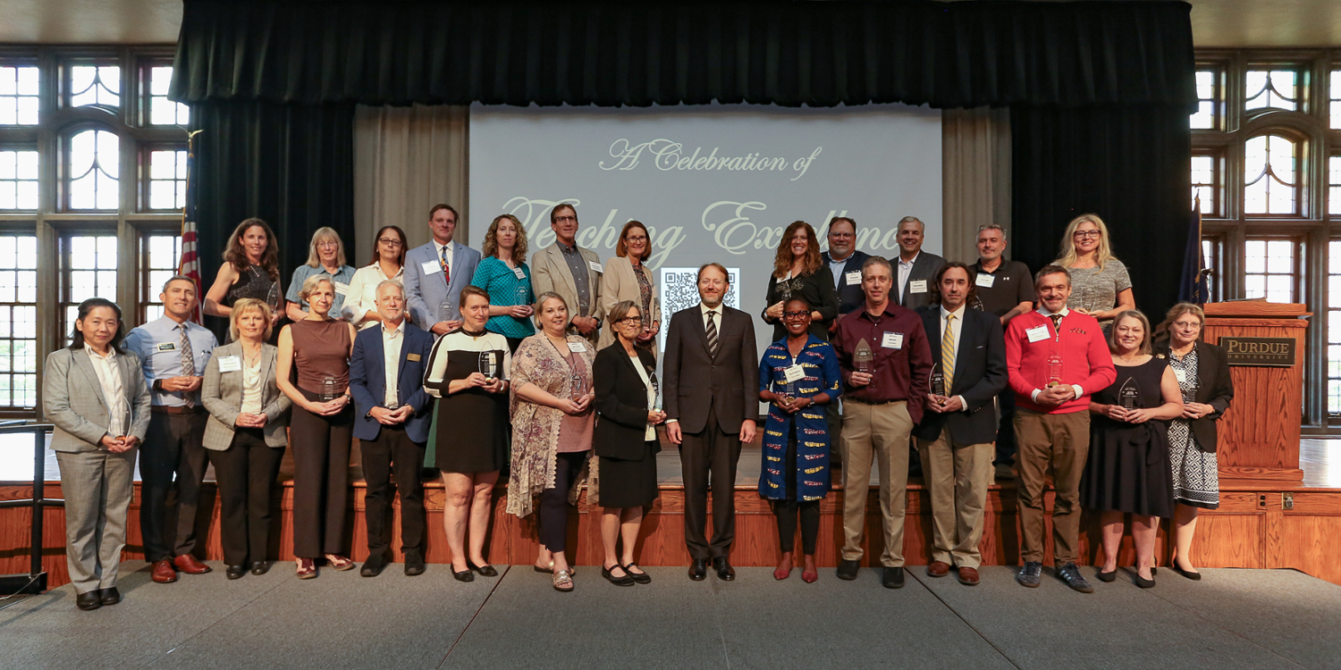 pictured: provost patrick wolfe stands with new inductees into the book of great teachers