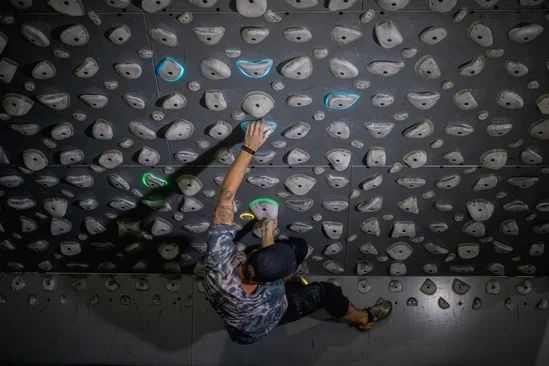 Climber on Kilter Board