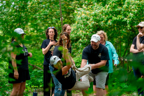 Group participating in the nitro crossing portion of the low challenge course