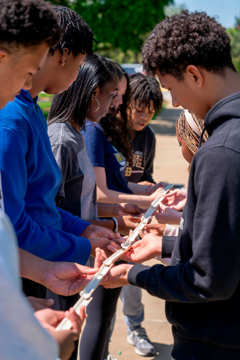 Group performing the pipeline portion of the portable challenge course