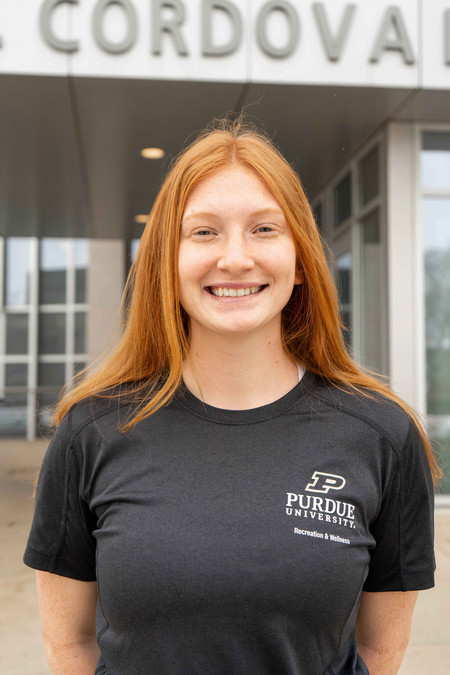 Outdoor headshot of personal trainer