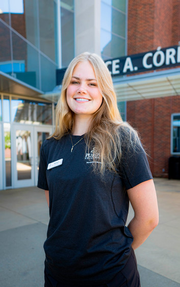 Outdoor headshot of personal trainer