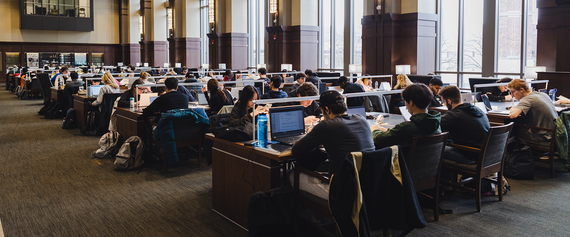 Students sitting at desks in the library