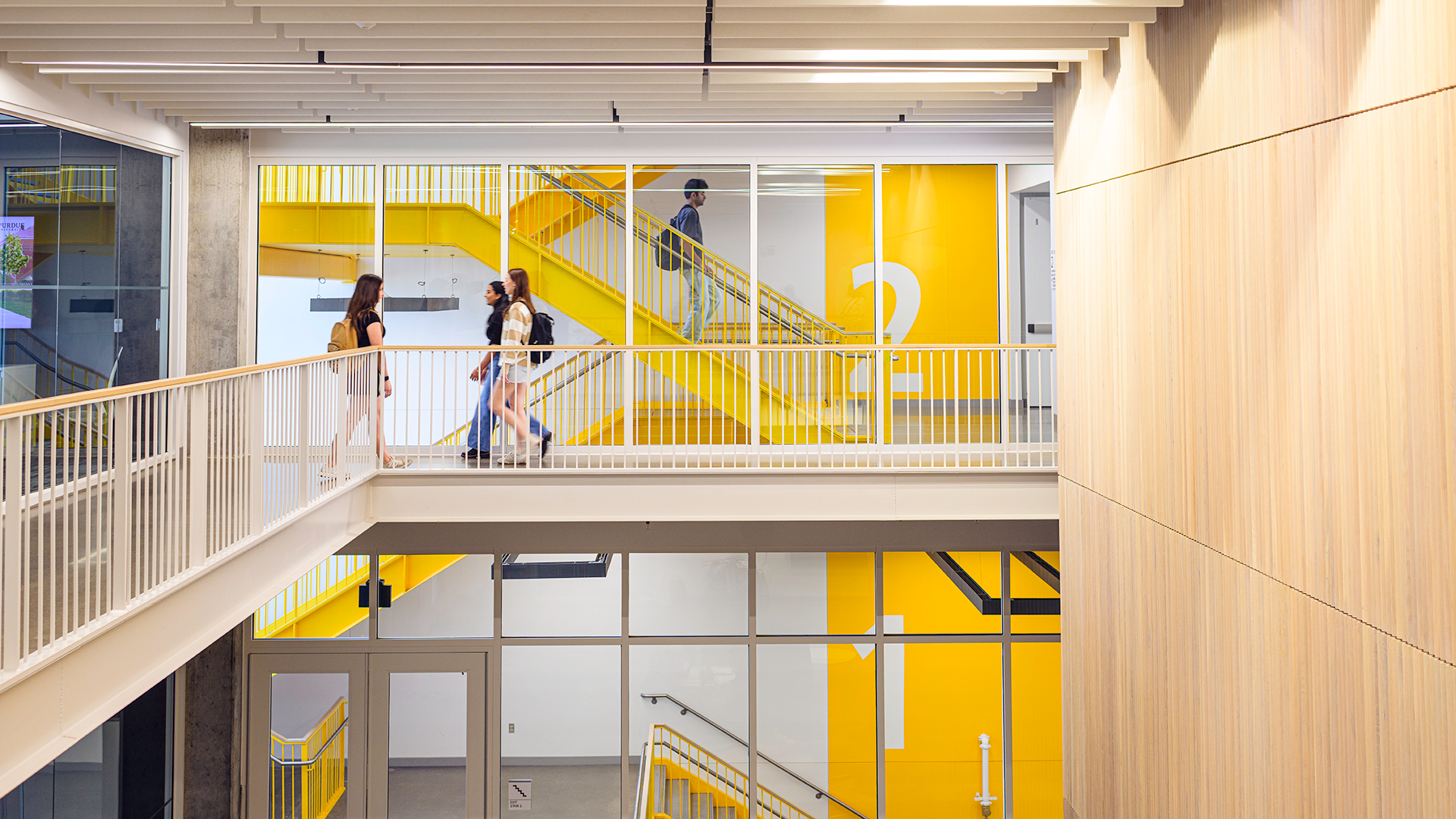Students walking down staircase in Dudley Hall
