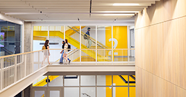 Students walking down staircase in Dudley Hall