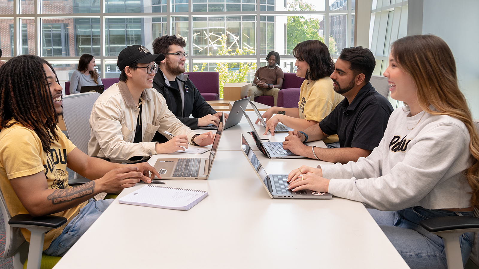 Students work together at a table