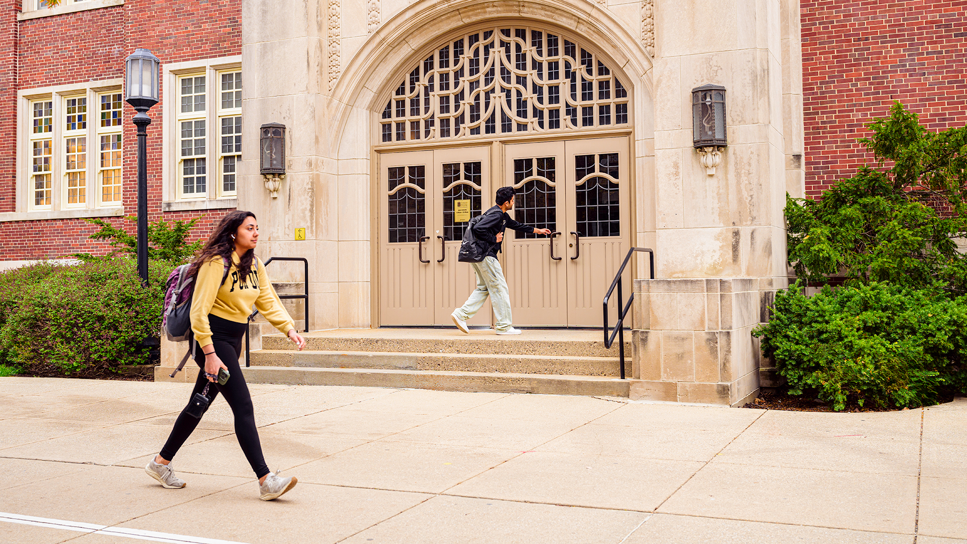 Student walking in front of Purdue Memorial Union