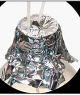 HPLC waste collection container opening with hoses going into it covered by foil.