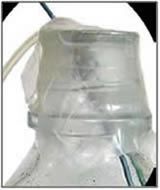 HPLC waste collection container opening with hoses going into it covered by Parafilm.