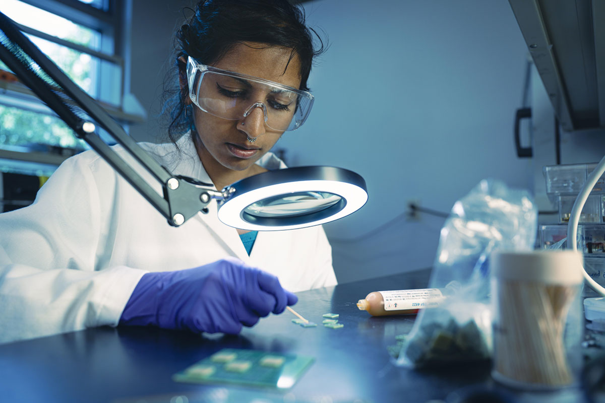 A researcher applies material to a silicon wafer