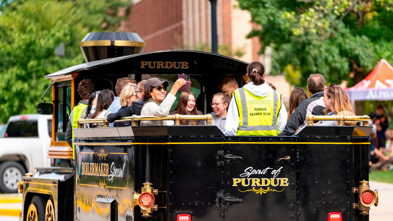 Purdue Reamer Club providing rides to alumni on the Boilermaker Special.