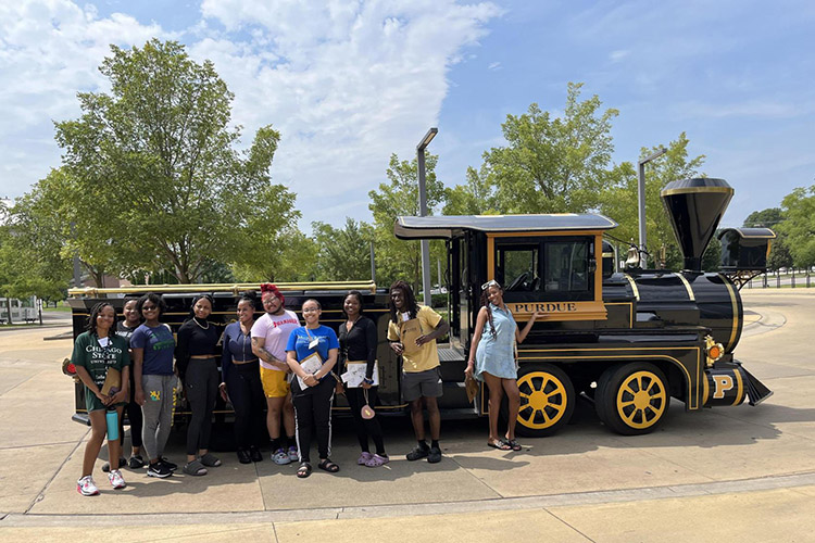 CSU students have arrived at Purdue, posing outside with the Purdue Boilermaker Special.