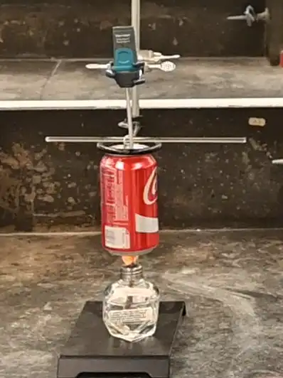 Photo 2: The flame from the fuel source should be very close to the bottom of the can.
