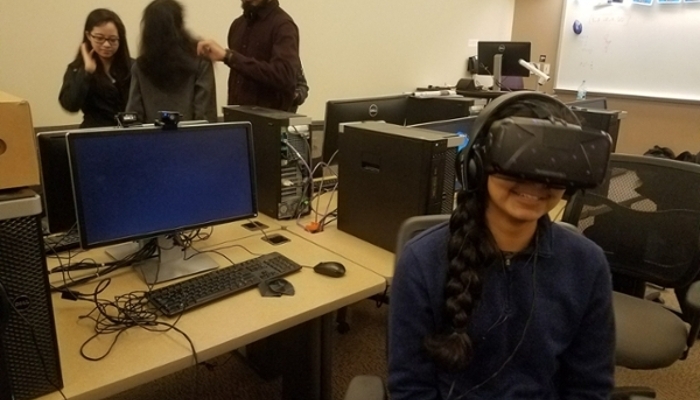 Visiting Student Explores the Virtual Reality Lab in the Computer Science Department