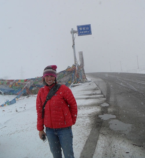 Lucy Flesch “standing on” the Erla Pass in Tibet.