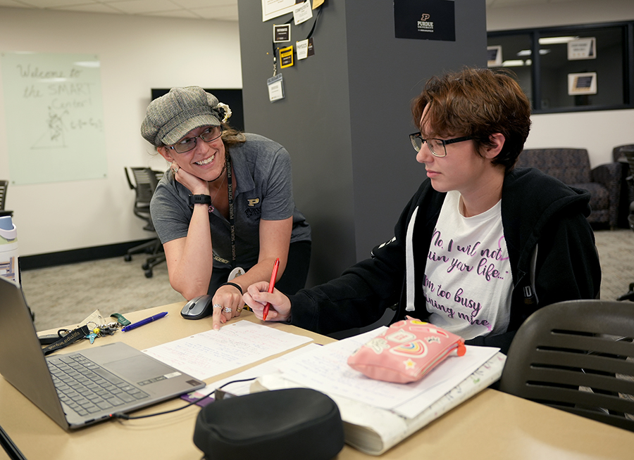 Student and center director working inside SMART Center