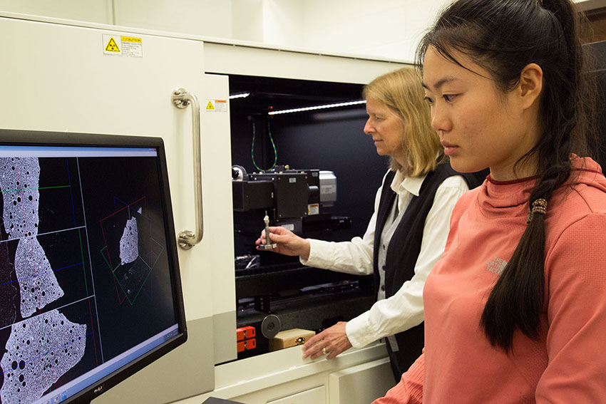 Physics professor Laura Pyrak-Nolte and graduate student Liyang Jiang use a 3D X-ray microscope.