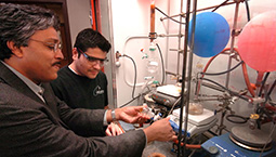 Professor Ghosh in Chemistry with graduate student.