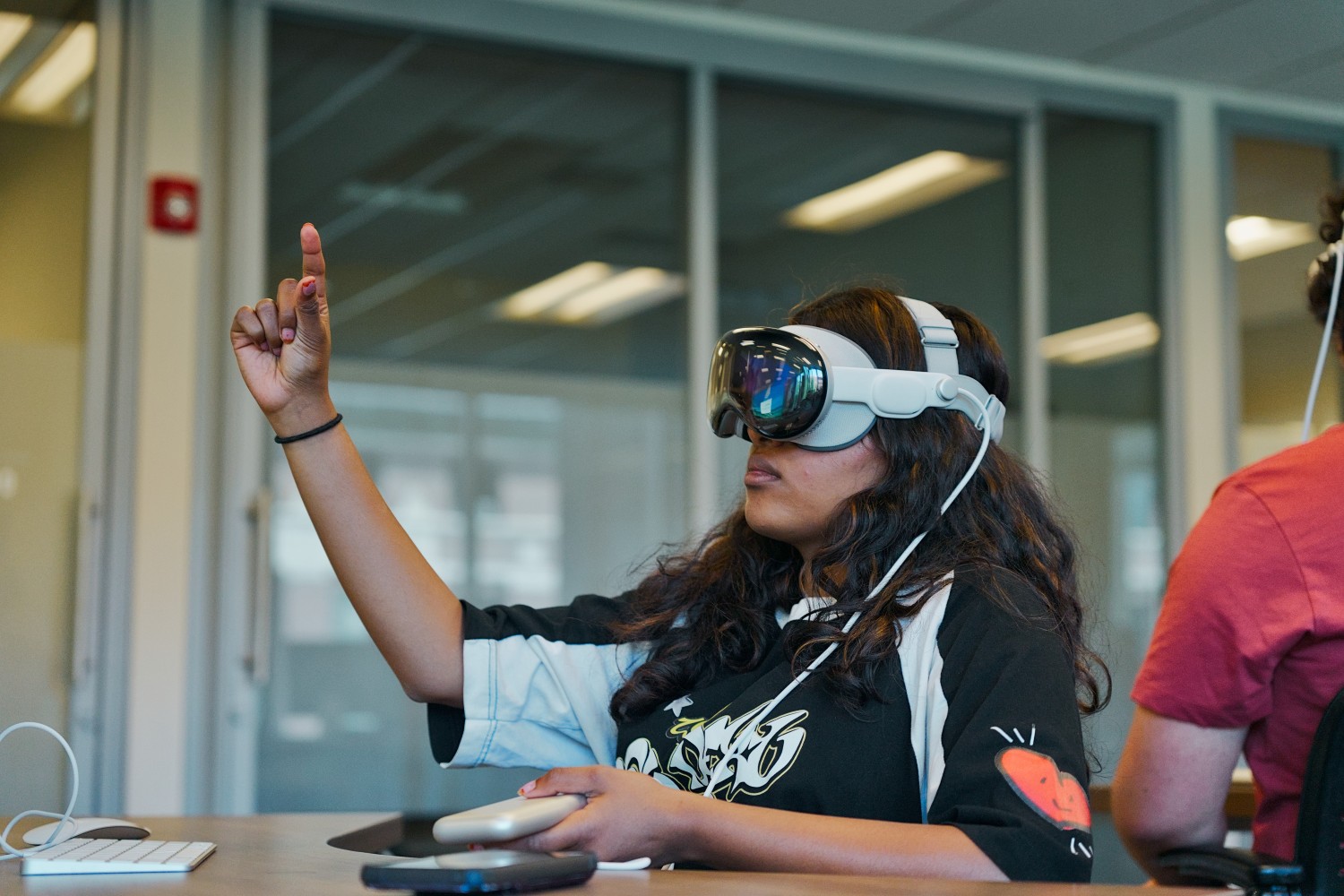 A student in the first class for Biomolecular Design, utilizing an Apple Vision Pro