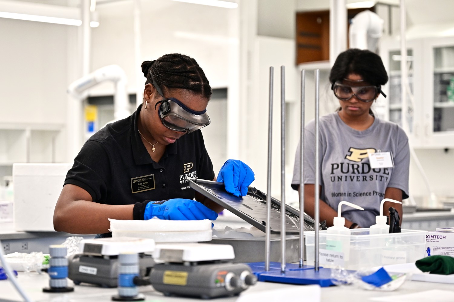 Two students doing lab work.